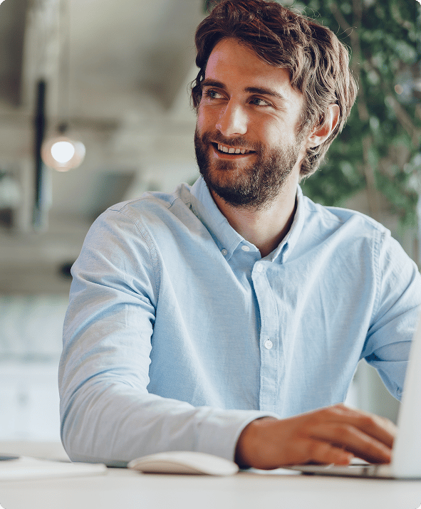 person-smiling-at-laptop
